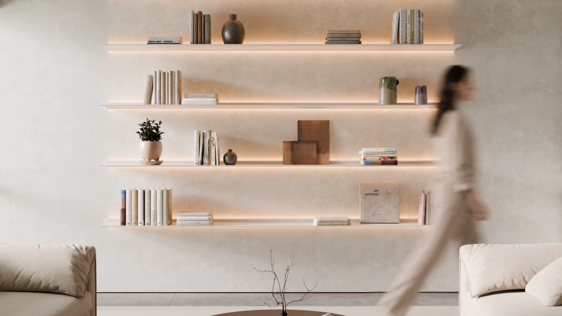 5 witte Horizon wandplank van Nimble Products met verlichting in een frisse woonkamer waar een vrouw langs loopt.